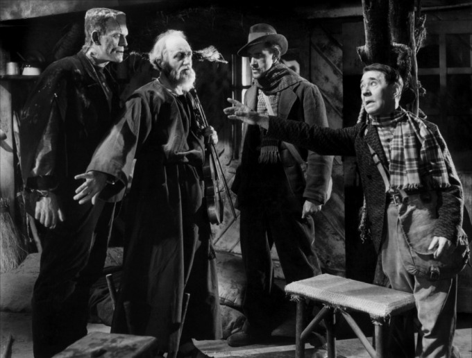 John Carradine - second from the right - in a small part as a hunter breaking up the friendship between O.P. Heggie and Boris Karloff.