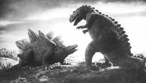 A production still of the fight between a Stegosaurus and a T. Rex. 